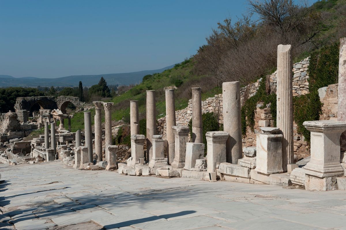 Columns of different heights and styles along Curetes Street in Ephesus, fluted shafts standing beside plain ones on mismatched bases